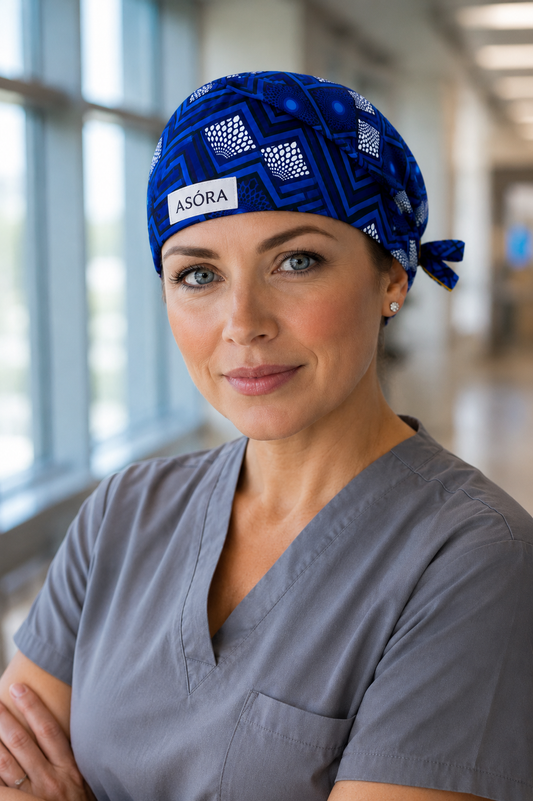 Model wearing light blue geometric ASORA scrub cap