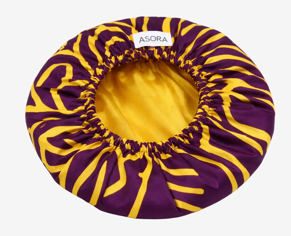 Purple and yellow striped hair bonnet with 'ASORA' branding on a white background