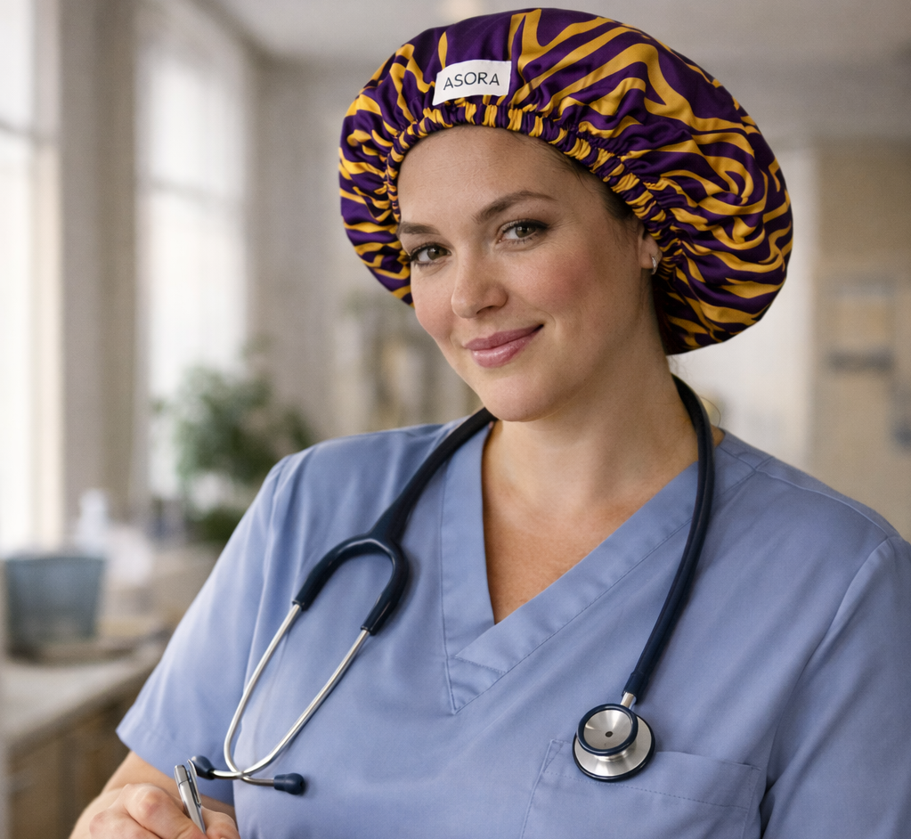 ASORA Ayaba Bonnet Cap, Nurse in blue scrubs with a stethoscope, holding a clipboard in a hospital setting.