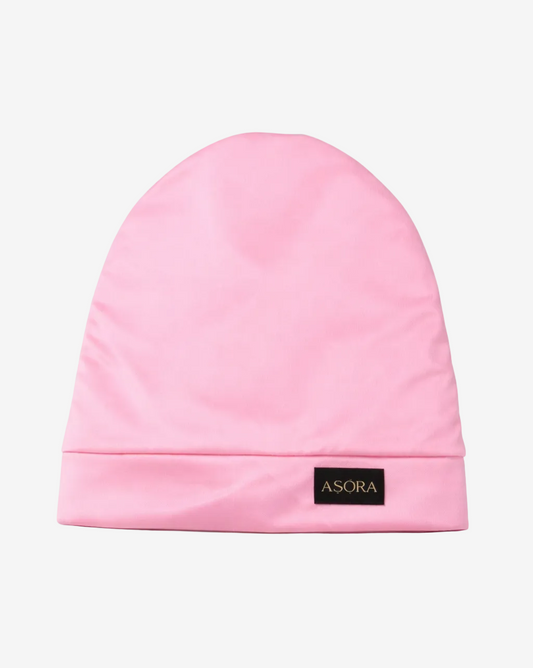 Pink slouch beanie with 'ASORA' logo on a white background
