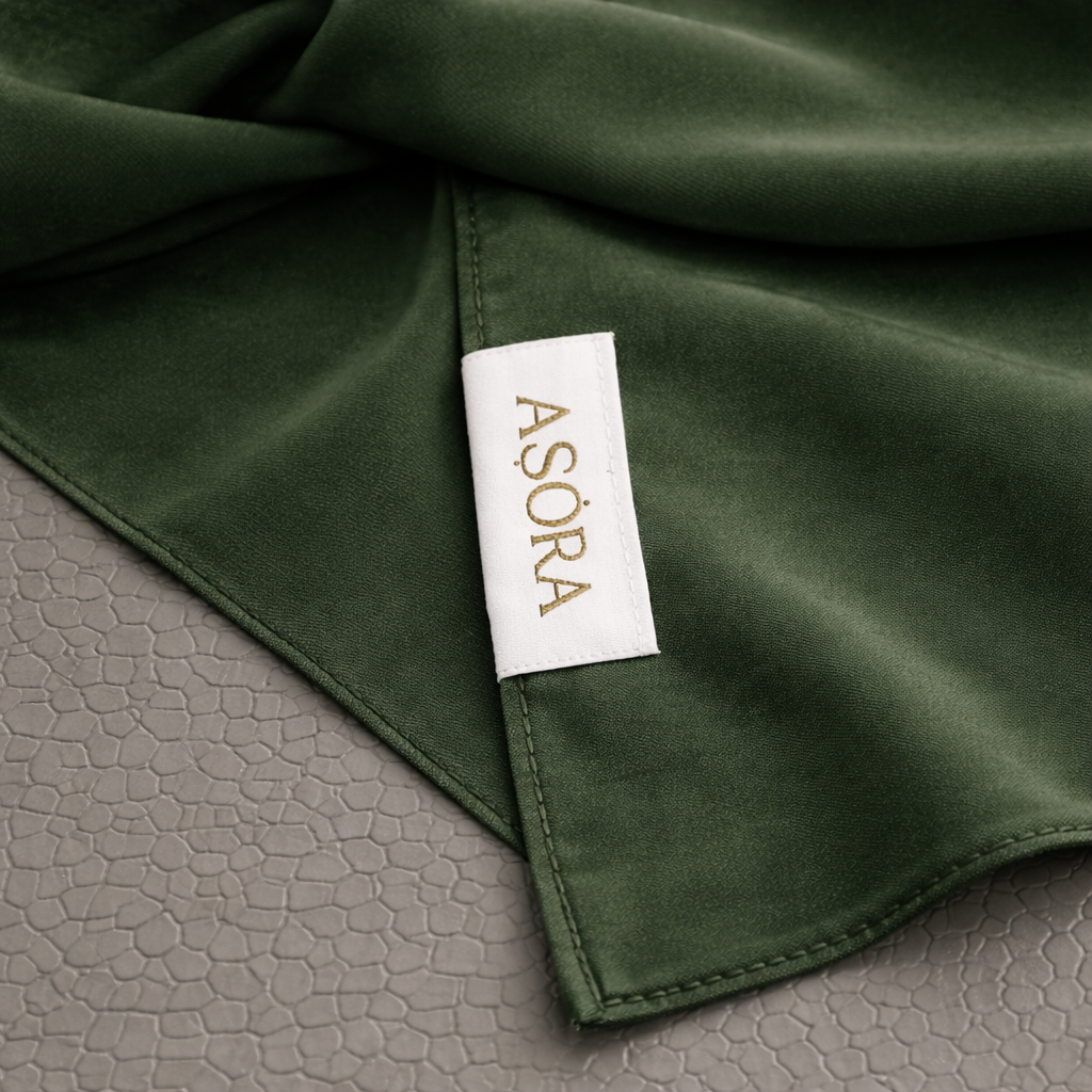 ASORA, Green medina silk scarf, Green scarf with a 'ASORA' label on a textured gray surface
