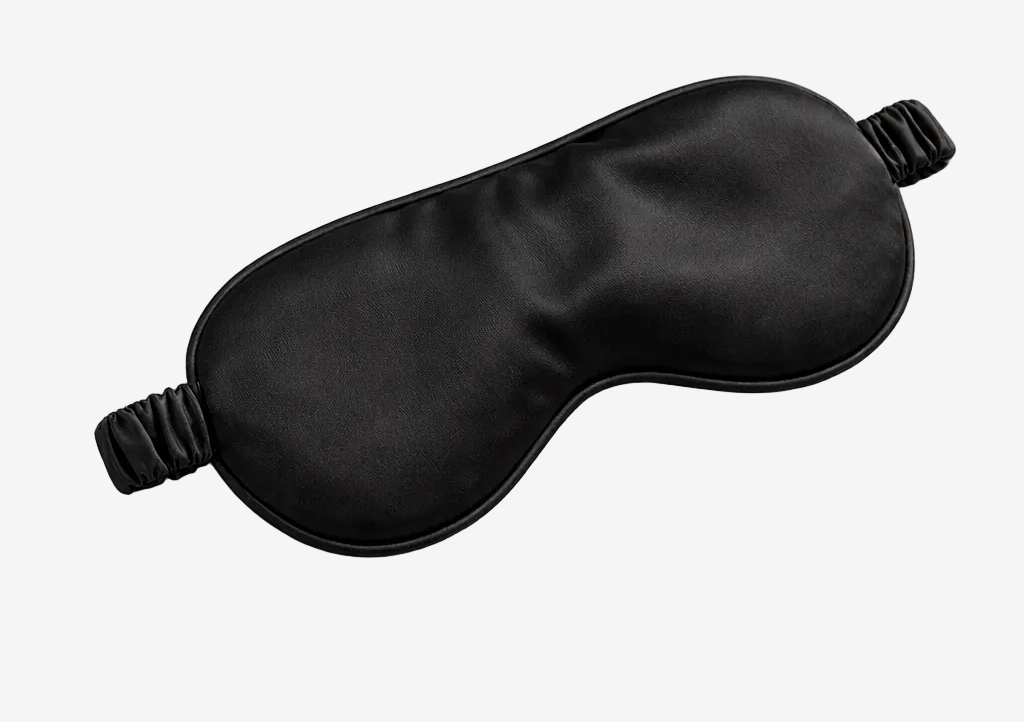 ASORA, Black satin eye mask on a light beige background