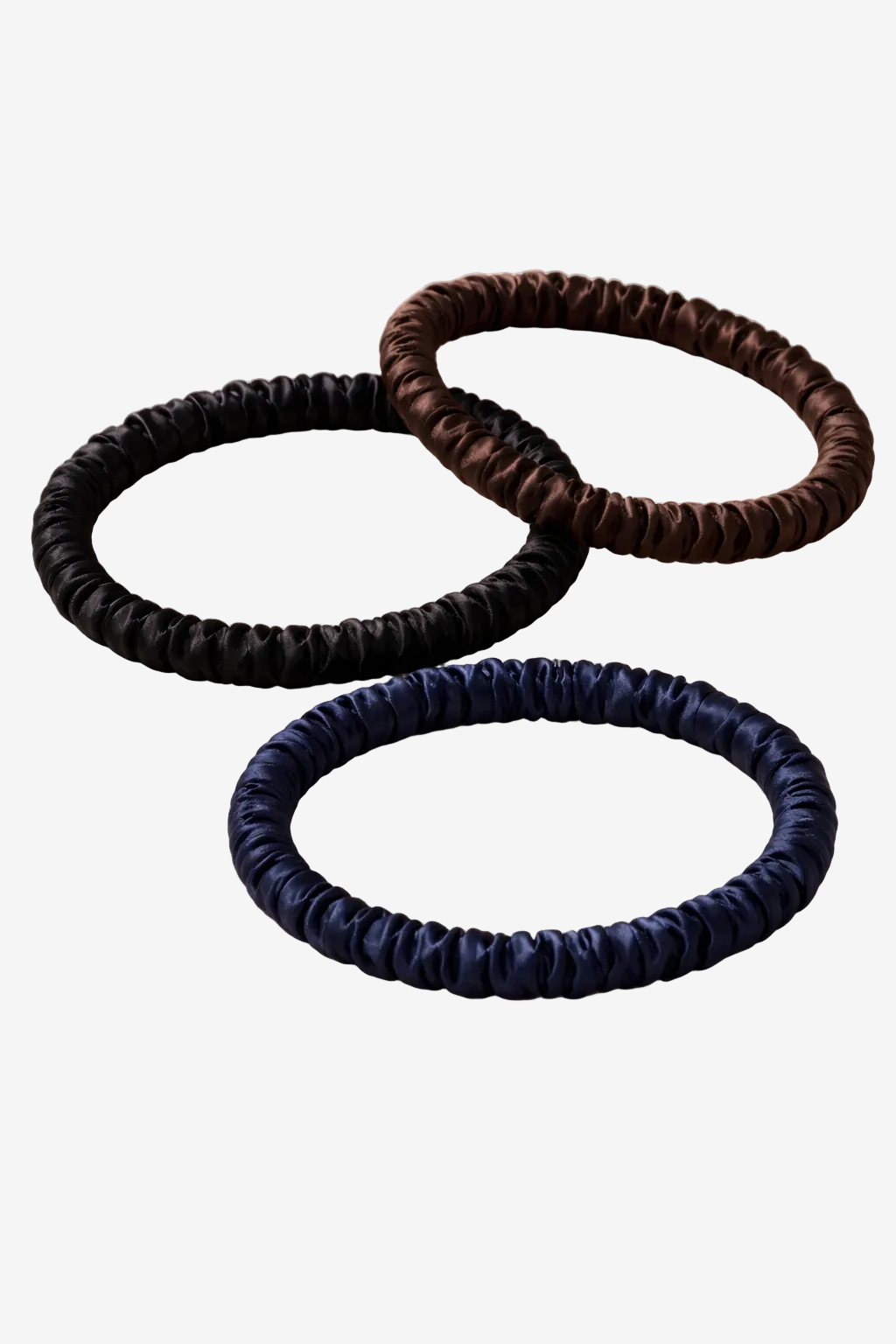 Three mulberry silk ASORA hair ties in black, brown, and blue 