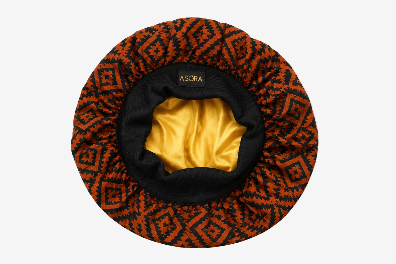 ASORA Bonnet with orange and black pattern on a white background