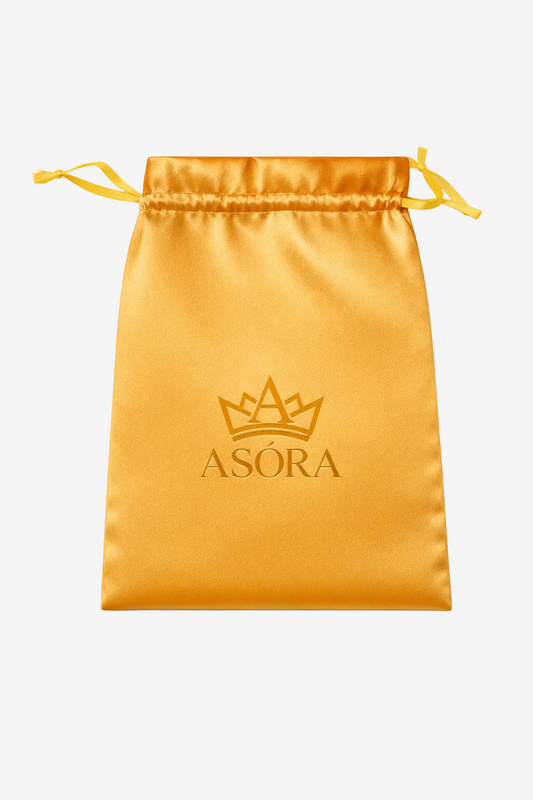 Gold drawstring pouch with 'ASORA' logo on a white background