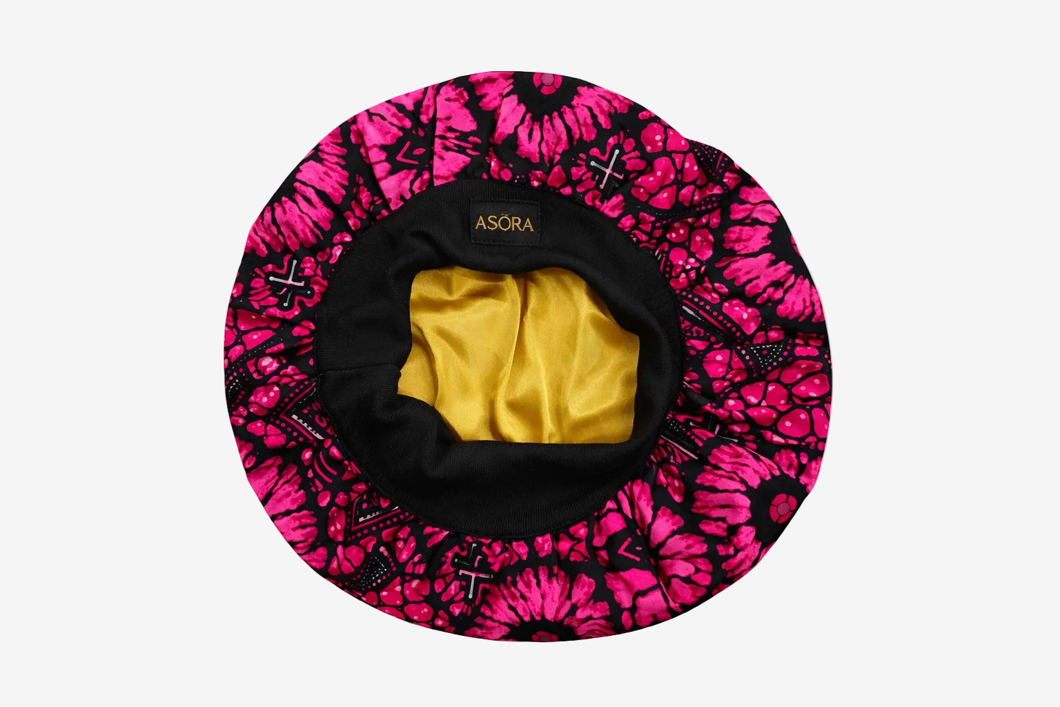 Pink and black patterned ASORA Crown bonnet with yellow interior on a white background