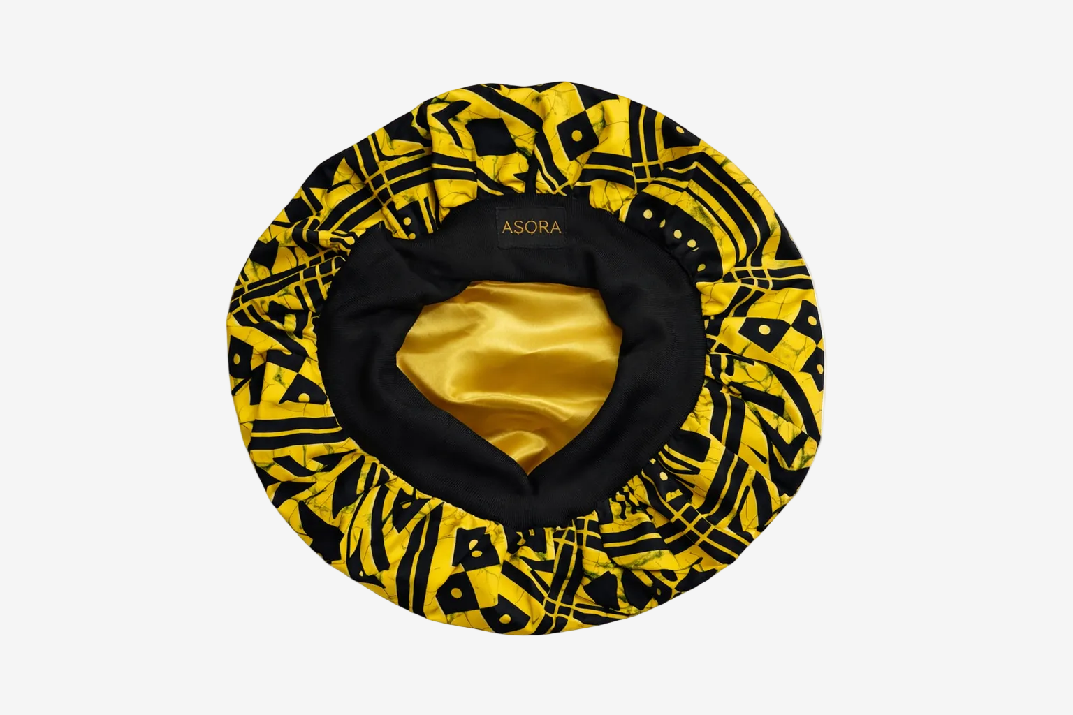 Yellow and black ASORA patterned Crown Bonnet with satin interior on a white background