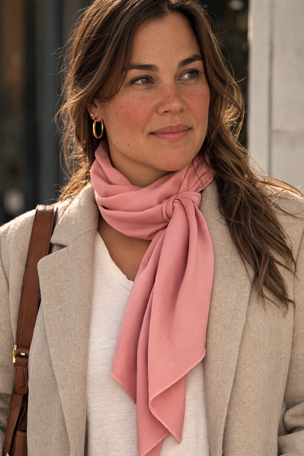 ASORA, Woman wearing a pink scarf and beige coat outdoors